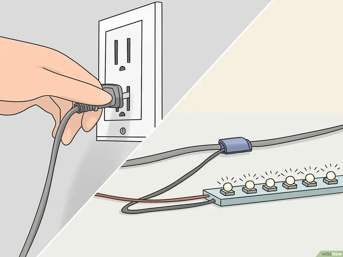 Main gauche brancher ruban led sur interrupteur. C&acirc;ble gris reli&eacute; &agrave; une prise murale. Bande de lumi&egrave;res LED allum&eacute;es.